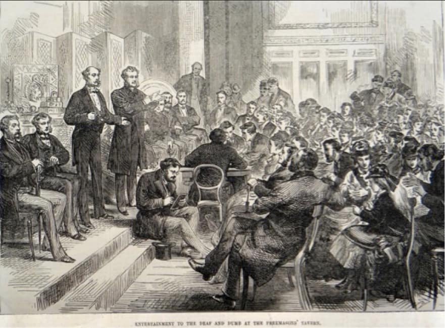 Ilustración histórica de una reunión de personas sordas comunicándose mediante lengua de signos en un salón de Londres.
