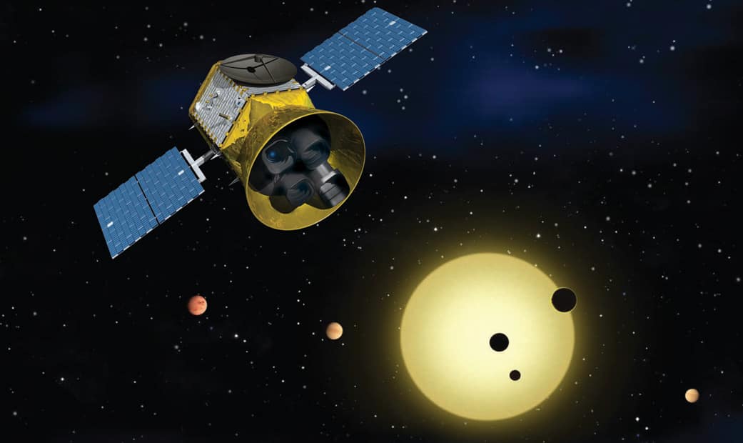 Representación del satélite TESS observando estrellas para detectar tránsitos de exoplanetas.